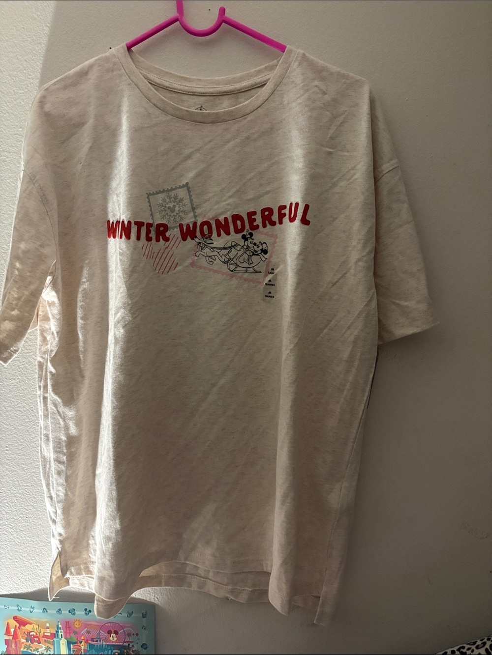 Disney Cream Graphic Christmas Tee with Pink and Black Stamp Motifs